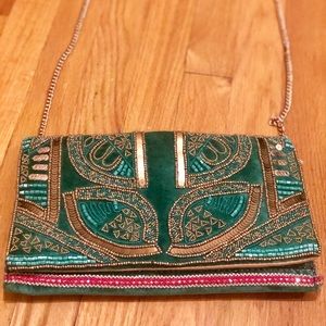 Franchesca’s emerald green and gold beaded clutch.